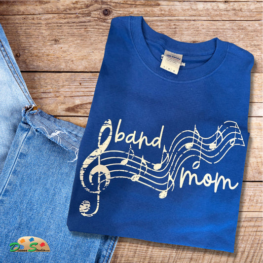 band mom design with music notes in white on blue tshirt