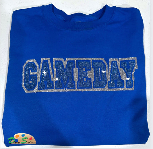 Gameday in blue and sliver glitter on a royal blue sweatshirt 