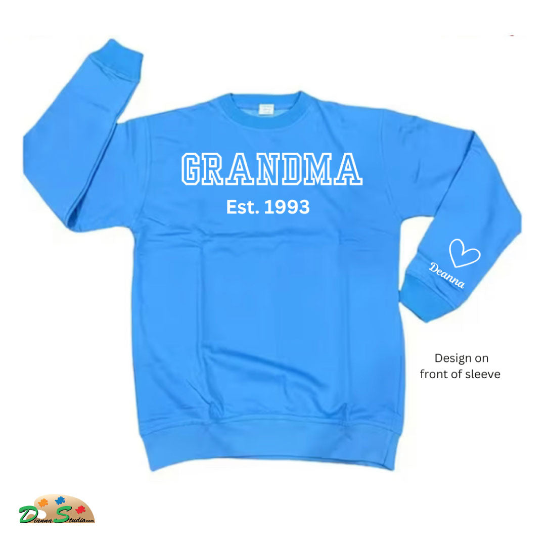 Established Auntie sky blue sweatshirt with kids name on sleeves in white