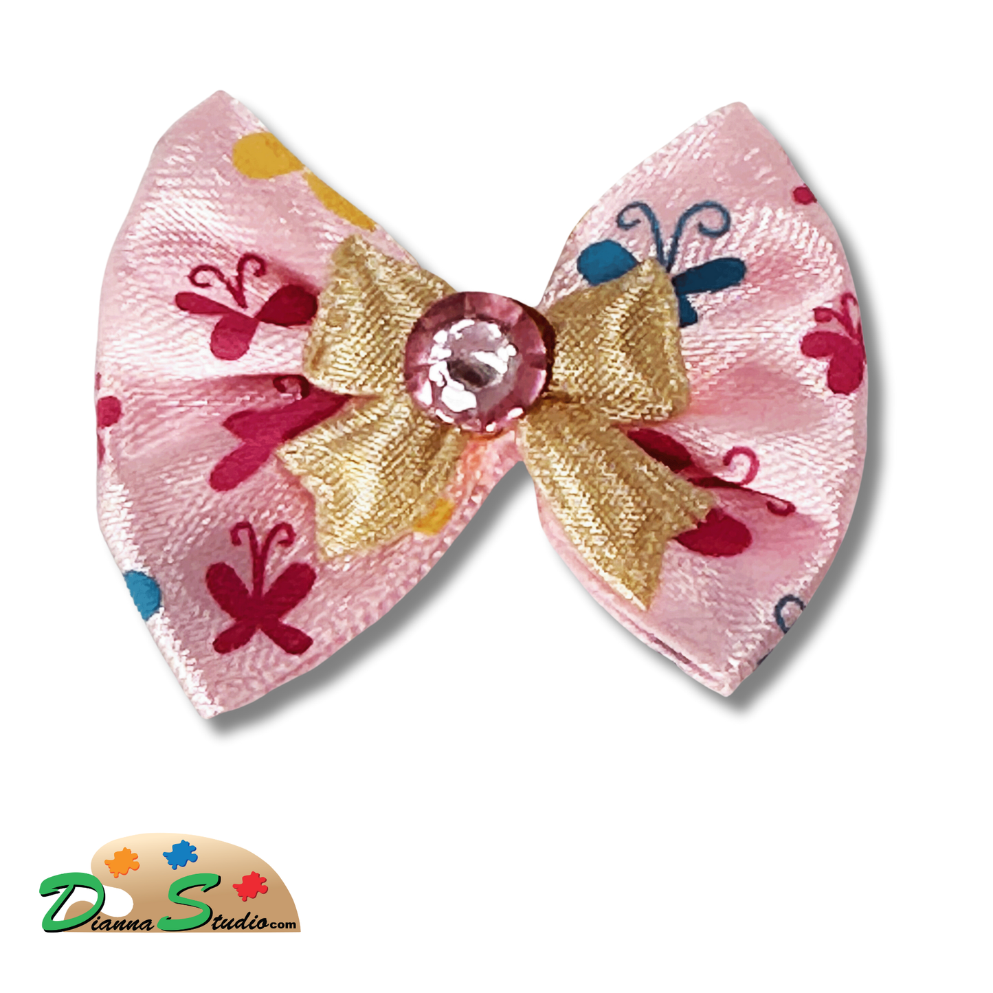 Pink bow with cream bow and pink diamond in center along with hot pink and teal butterflies pen bow