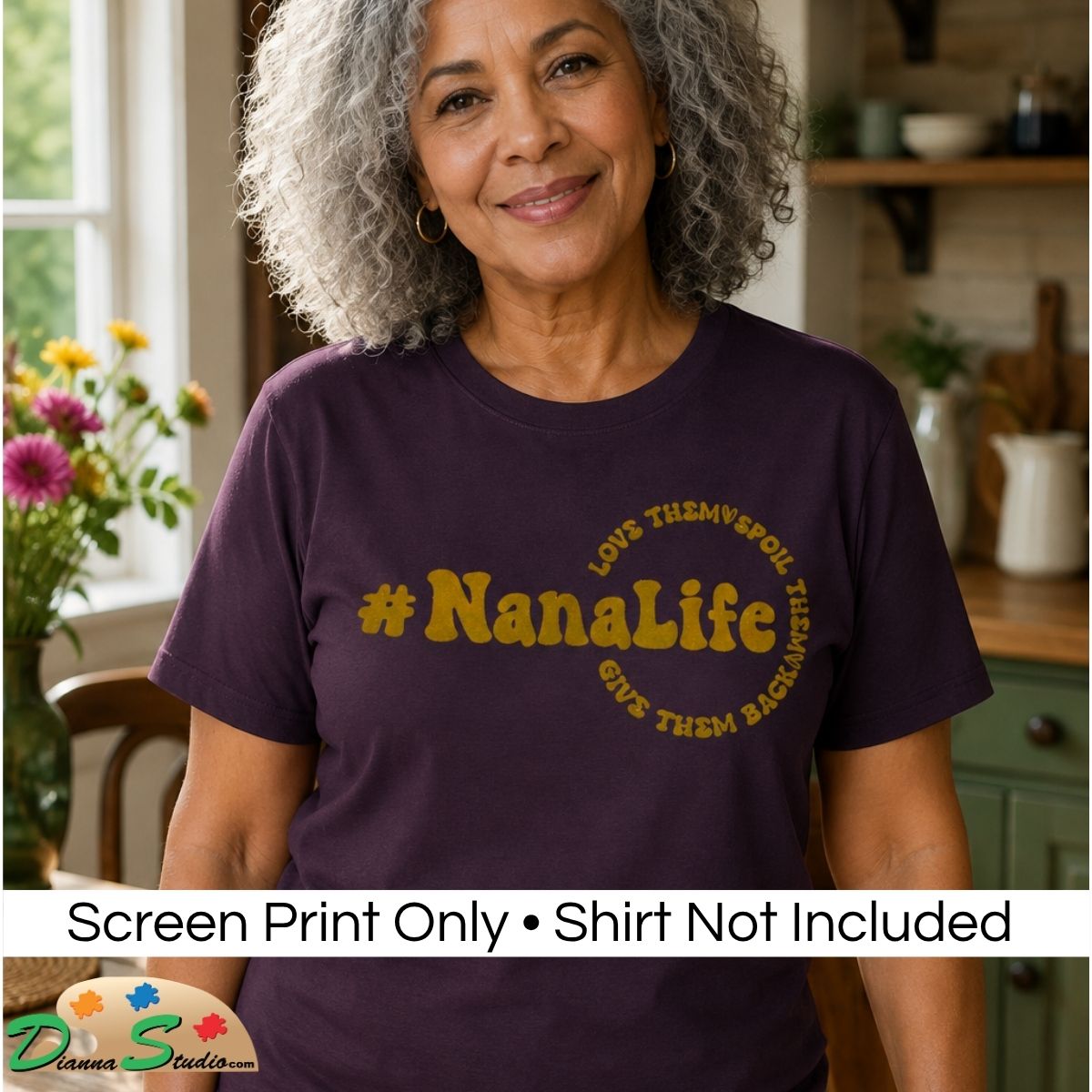 A smiling older woman with gray curly hair stands in a kitchen wearing a dark purple short-sleeve T-shirt with a muted gold graphic that reads “#NanaLife” and curved text around it. A banner at the bottom says “Screen Print Only • Shirt Not Included,” and a “DiannaStudio” logo appears in the lower left.