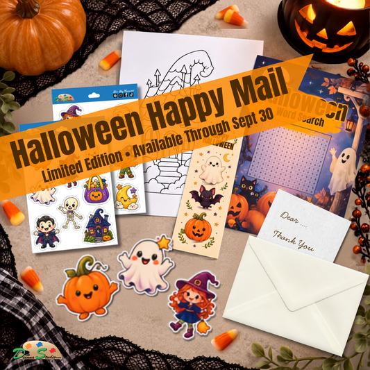 Halloween-themed stationery set displayed on a beige surface with decorative props including pumpkins, a jack-o'-lantern, black lace, candy corn, and a candle. The set includes sticker sheets with cartoon ghosts, witches, pumpkins, and bats, a coloring page, a thank-you note, and an envelope.