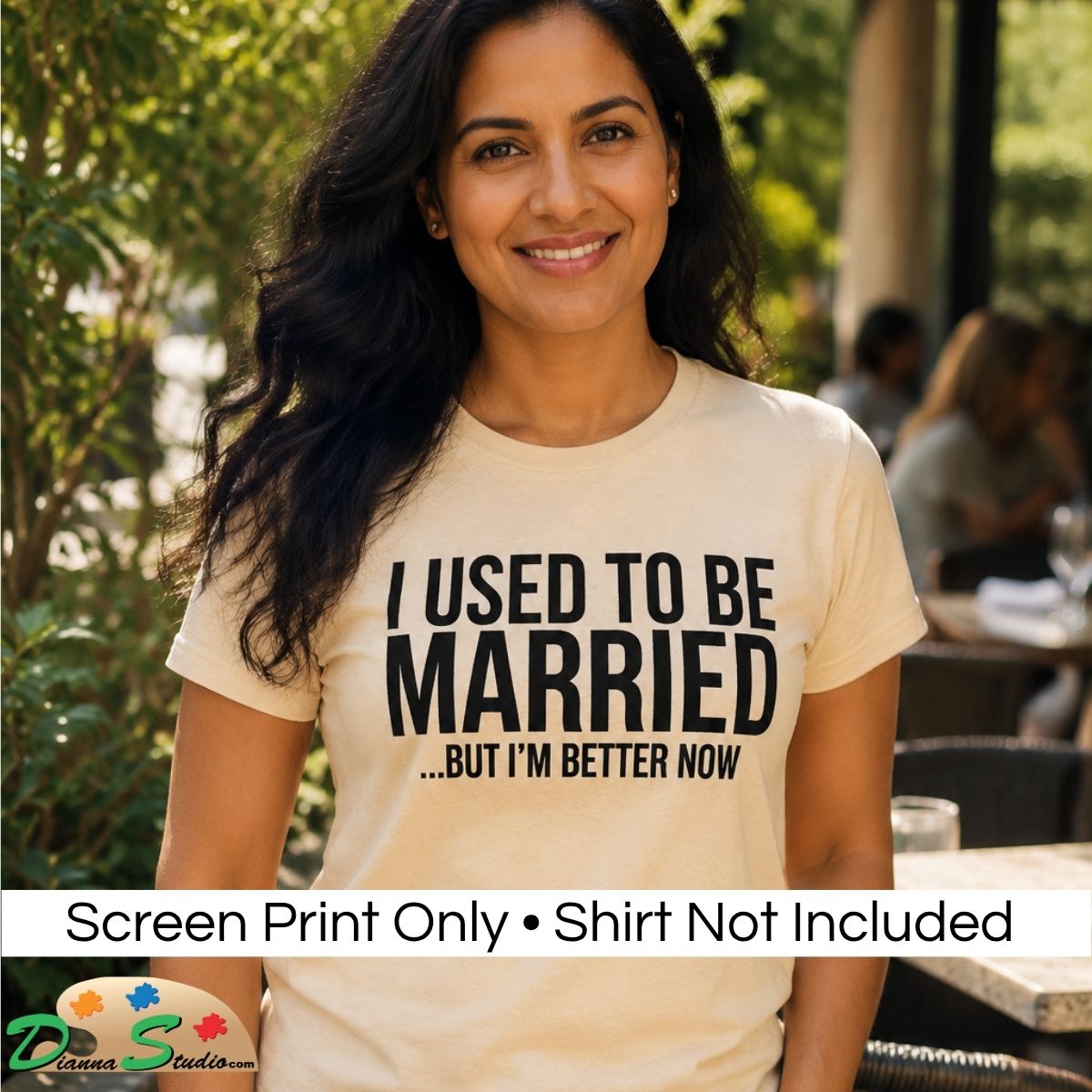 A woman wearing a cream-colored graphic t-shirt with the text 'I USED TO BE MARRIED …But I’m Better Now.